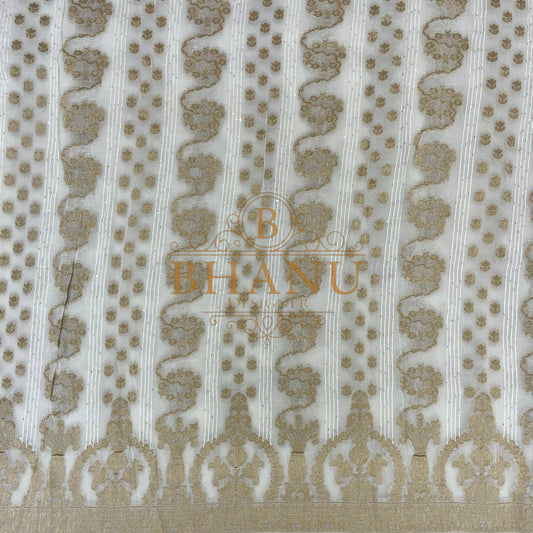 Ivory with gold columns and an arched hem - fabric by the metre
