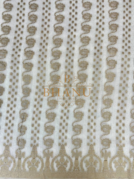 Ivory with gold columns and a scalloped hem - fabric by the metre
