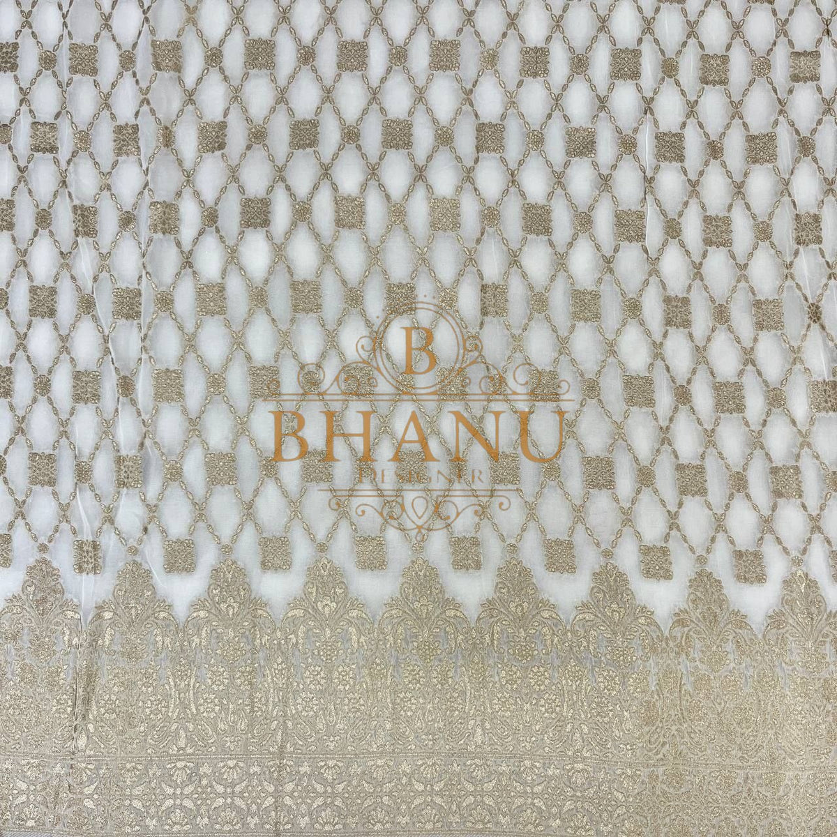 Ivory with gold lattice and a woven border - fabric by the metre