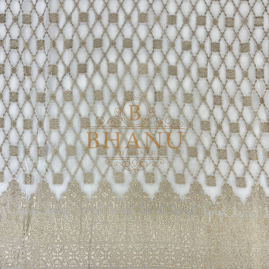 Ivory with gold lattice and a woven border - fabric by the metre