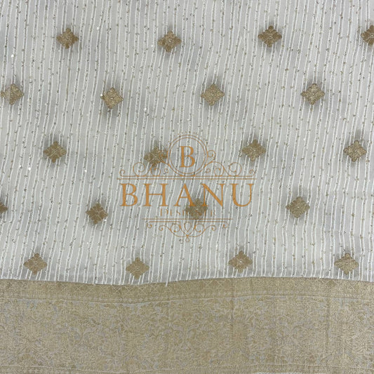 Ivory with gold butti and a gold border - fabric by the metre