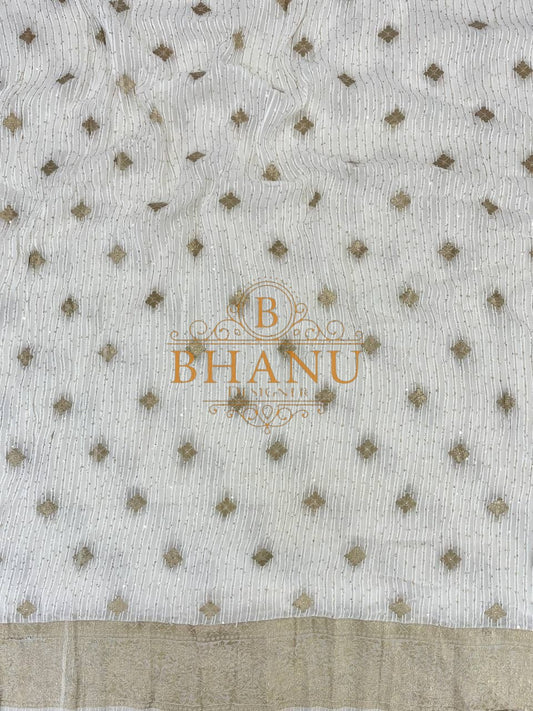 Ivory with fine gold butti and a border - fabric by the metre