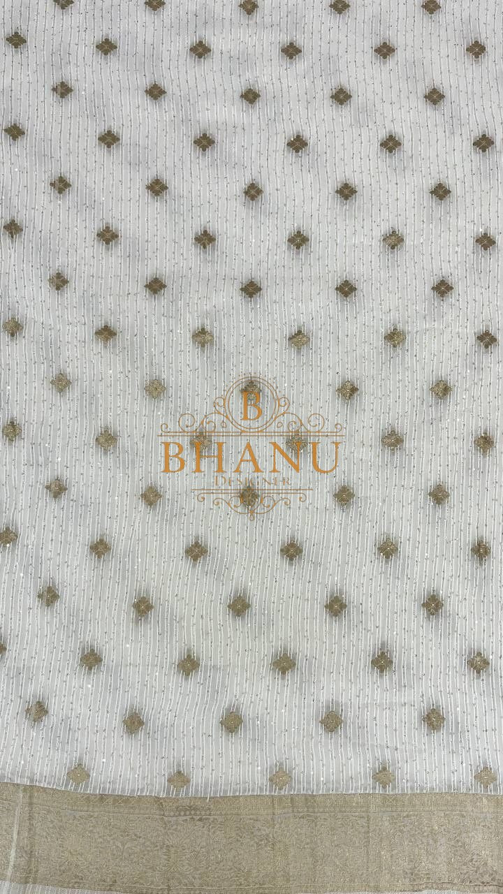 Ivory with fine gold butti and a border - fabric by the metre