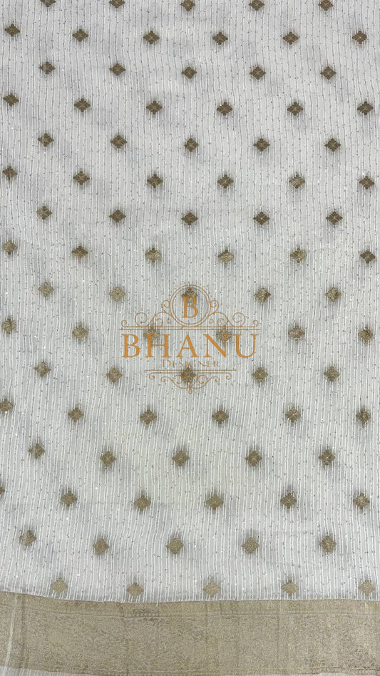 Ivory with fine gold butti and a border - fabric by the metre