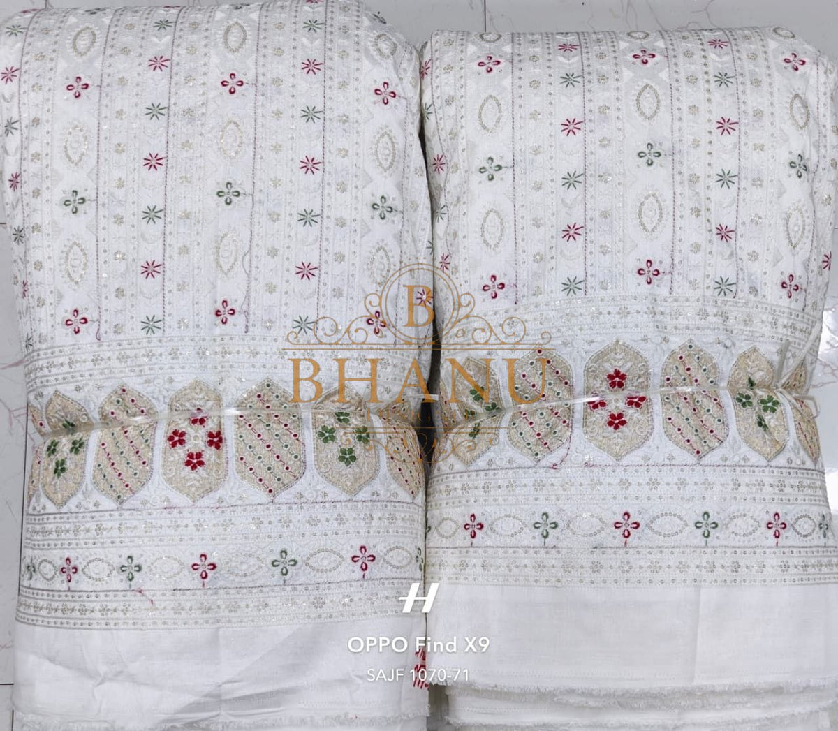 White with fine pink and green embroidery - fabric by the metre