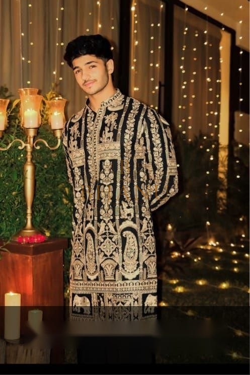 Black with dense gold embroidery throughout - sherwani