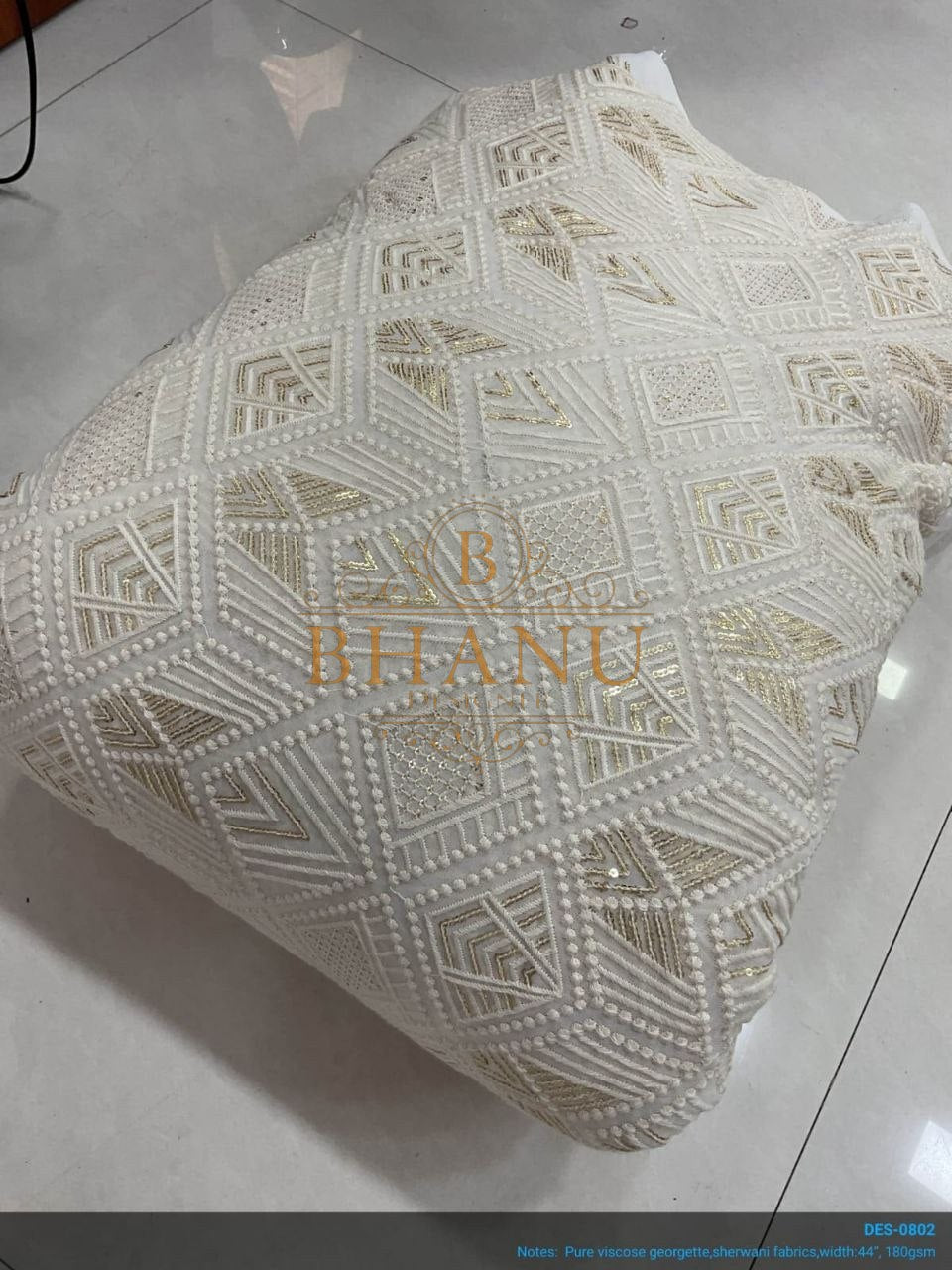 Ivory with geometric cutwork - fabric by the metre
