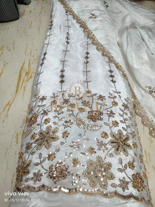 White satin with a gold sequin floral hem - fabric by the metre