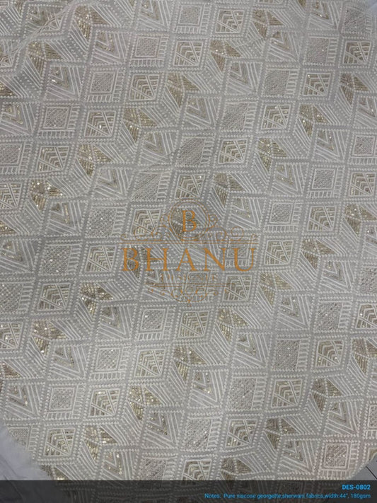 Ivory with tonal geometric work - fabric by the metre