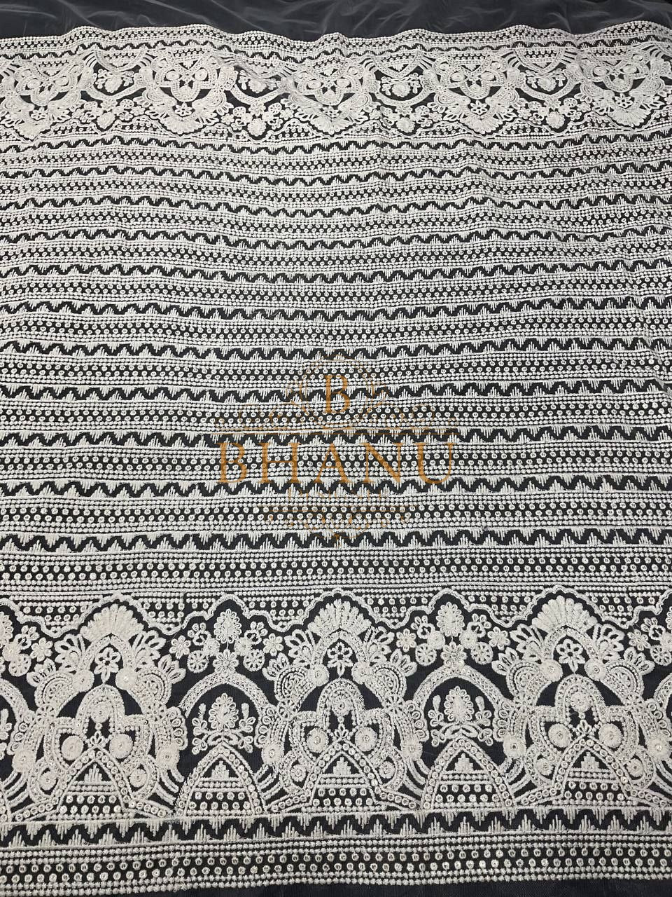 Ivory with geometric banding - fabric by the metre