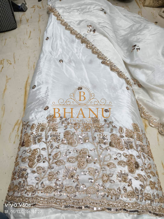 White satin with a gold sequin hem - fabric by the metre