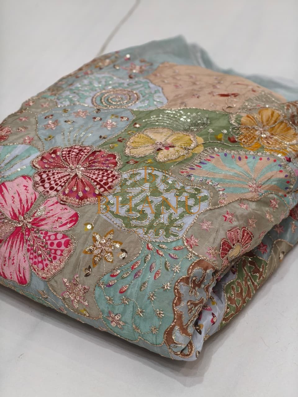 Grey with pastel floral applique - fabric by the metre