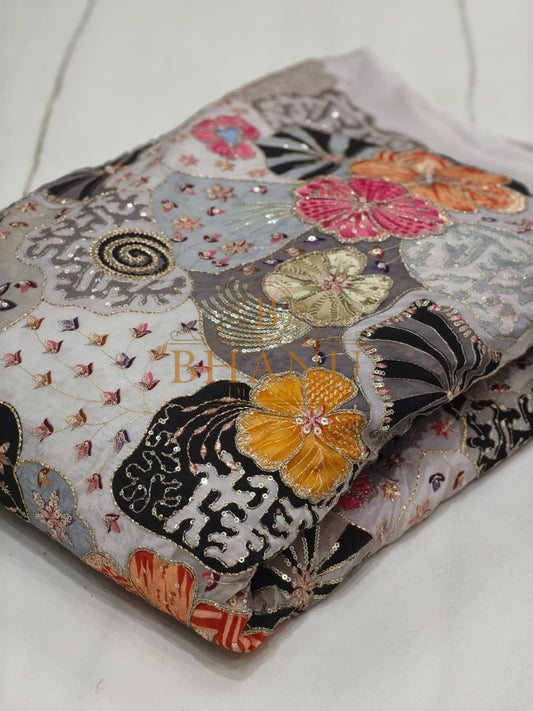 Grey with black and orange floral work - fabric by the metre
