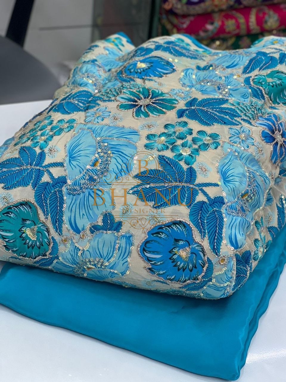 Blue with teal floral work - fabric by the metre
