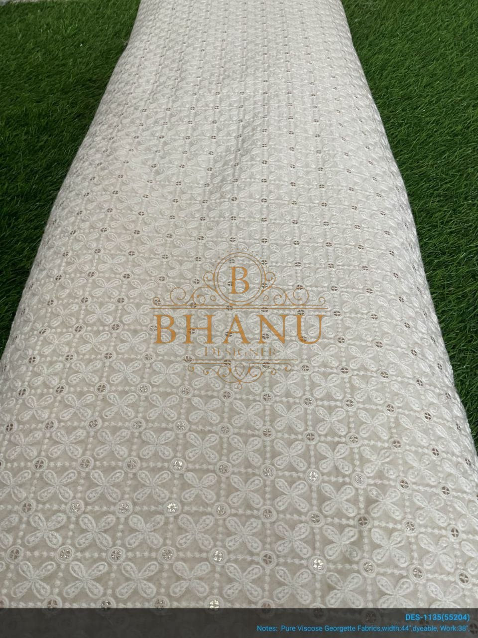 Ivory with tonal cutwork, on the roll - fabric by the metre