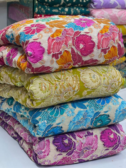 Floral work in pink, yellow, blue and purple - fabric by the metre