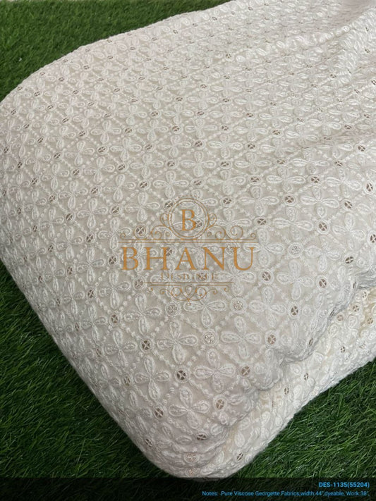 Ivory with tonal cutwork, folded - fabric by the metre