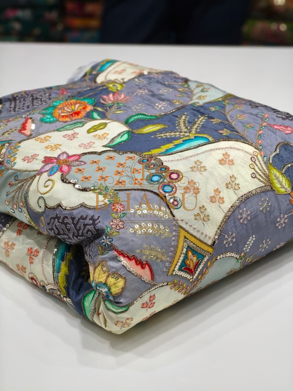 Grey and cream with a multicolour Mughal print - fabric by the metre