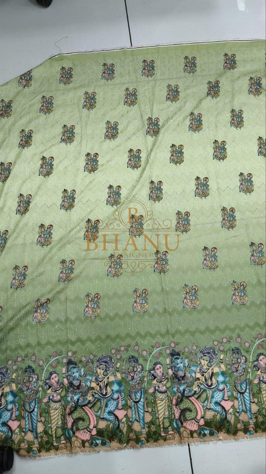 Pale green with butti and a multicolour hem - fabric by the metre