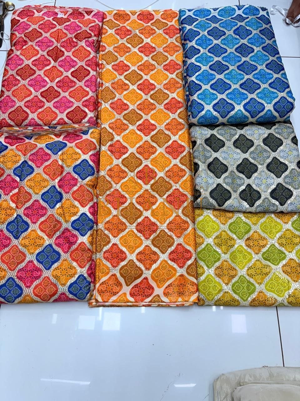 Bandhani print in pink, orange and blue - fabric by the metre
