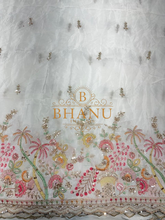 Ivory with a multicolour floral hem - fabric by the metre