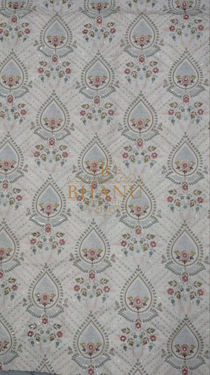 Pale ground with a fine teardrop print - fabric by the metre