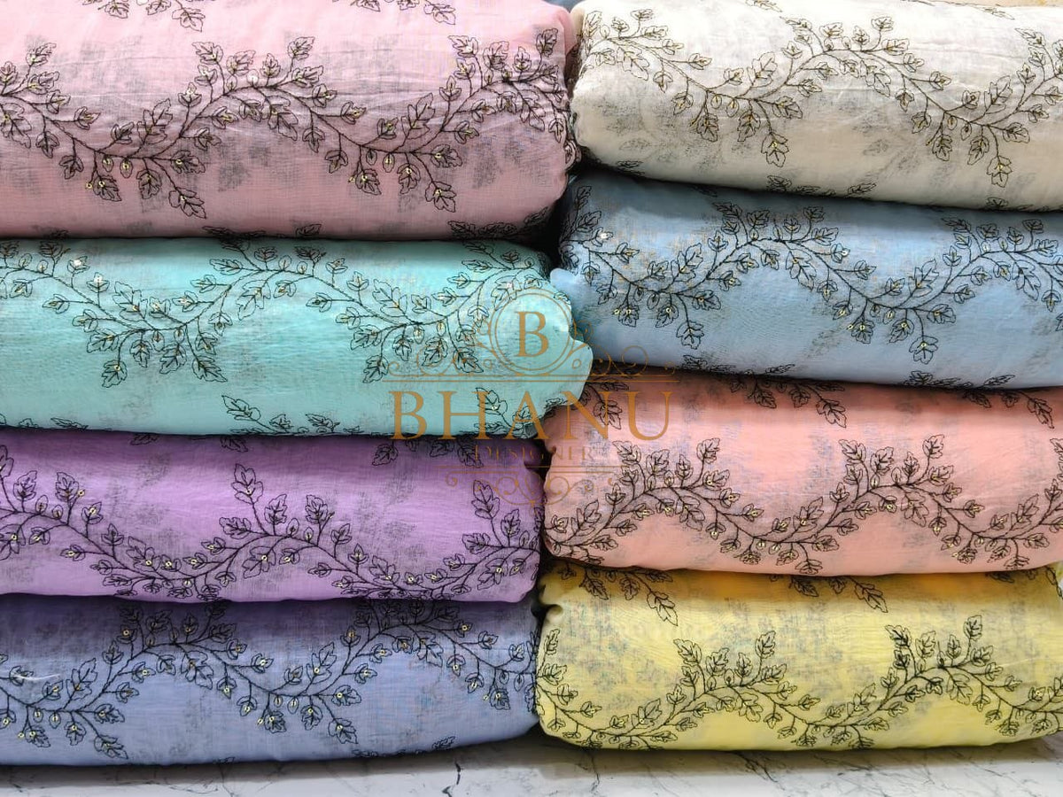 Pastel grounds with an embroidered hem - fabric by the metre