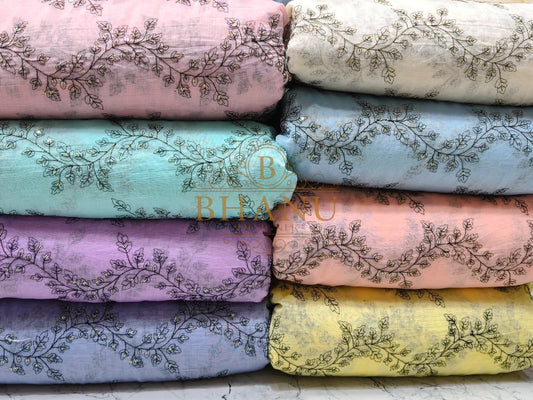 Pastel grounds with an embroidered hem - fabric by the metre