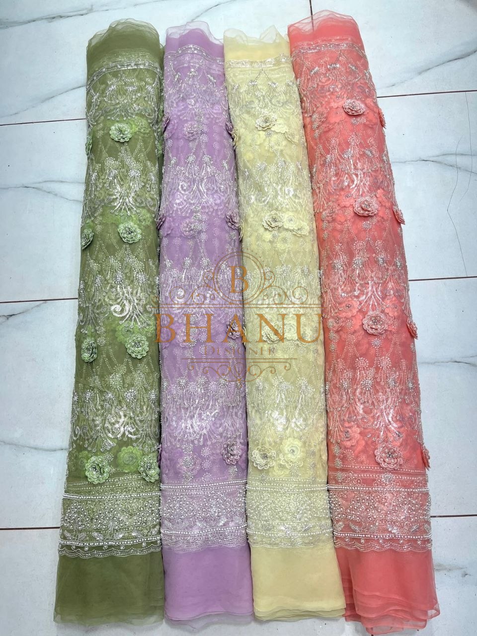 Green, lilac, yellow and coral with an embroidered hem - fabric by the metre