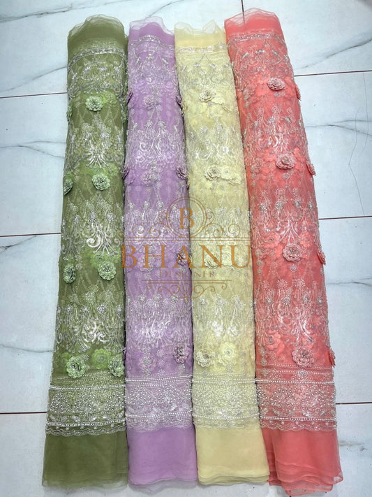 Green, lilac, yellow and coral with an embroidered hem - fabric by the metre