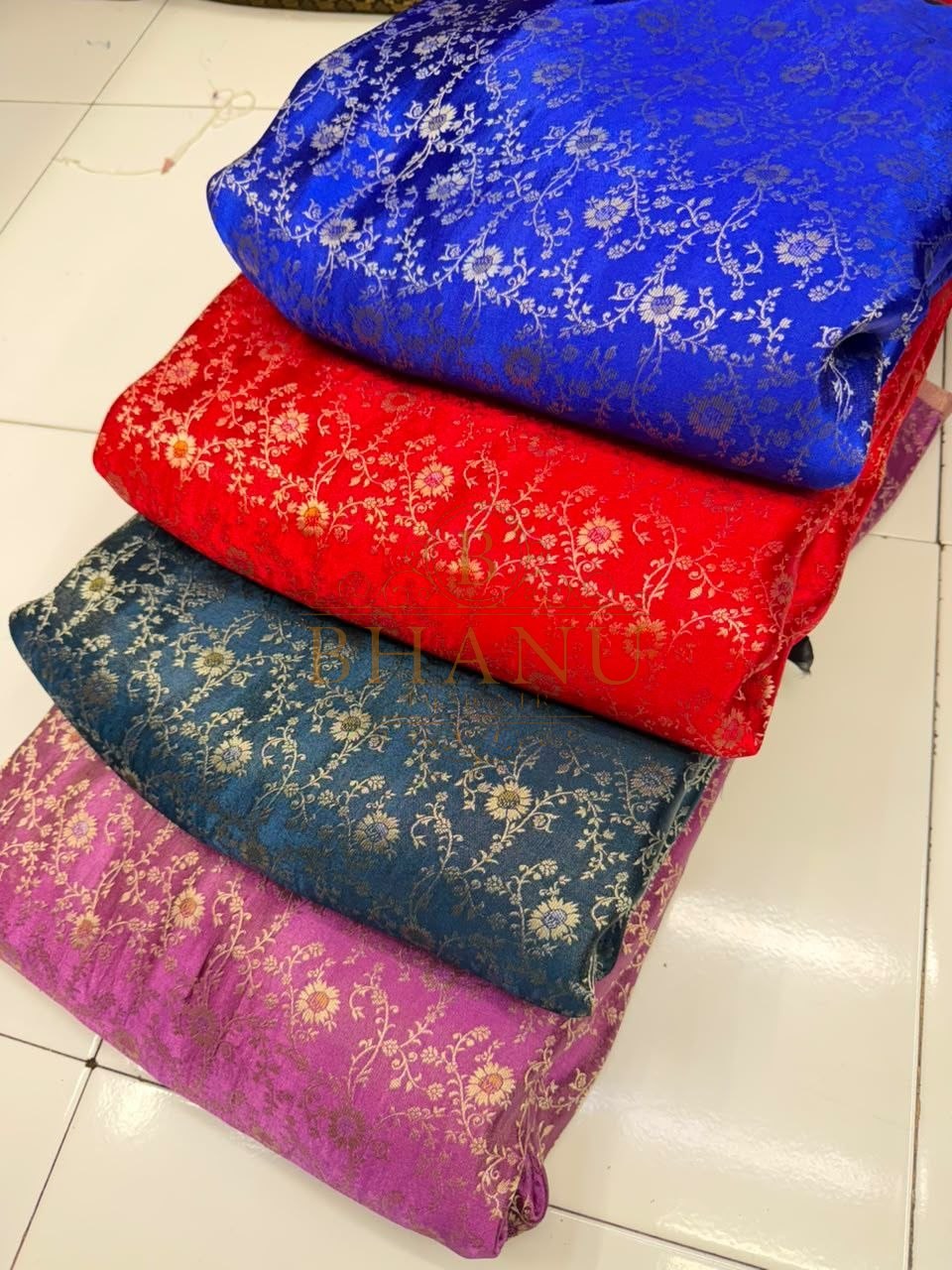 Brocade in blue, red, teal and pink - fabric by the metre