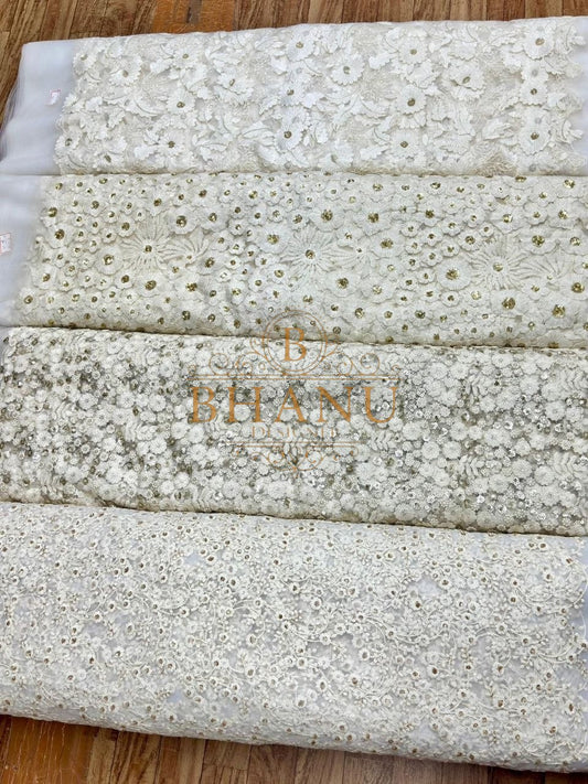 Ivory with white cutwork embroidery - fabric by the metre