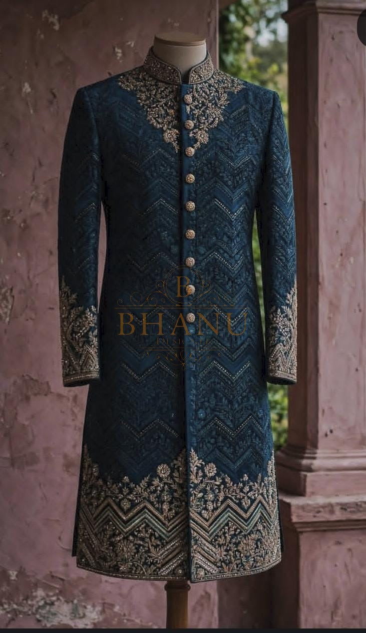 Deep teal sherwani embroidered all over, with a geometric band at the hem