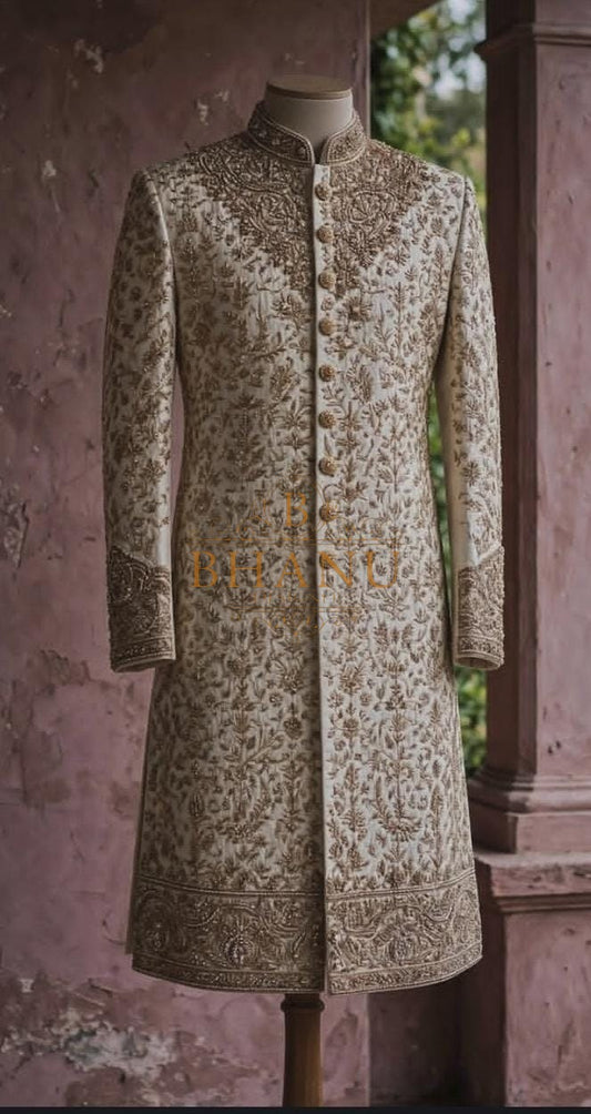 Ivory sherwani worked tone on tone over the whole garment
