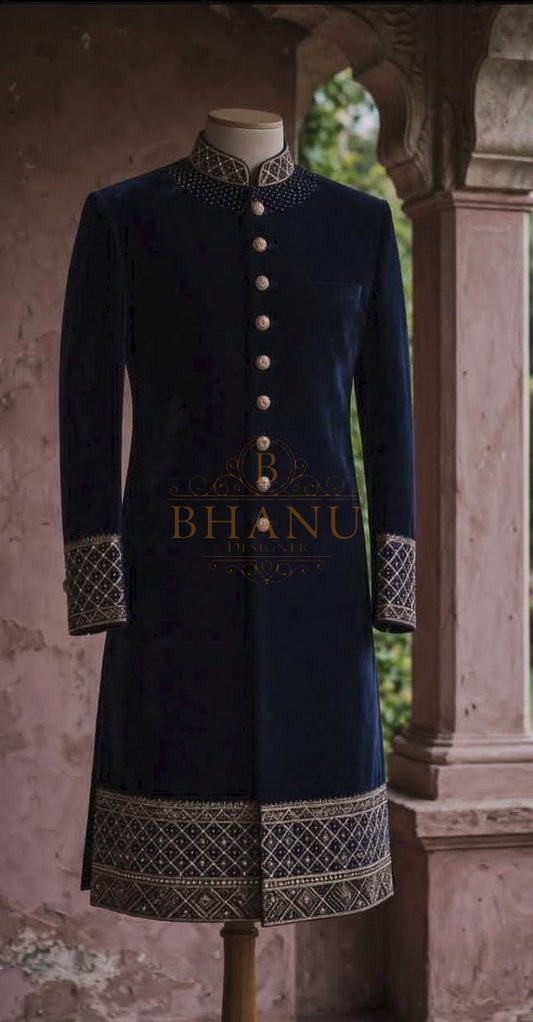 Dark navy sherwani with embroidery at the collar, cuffs and hem