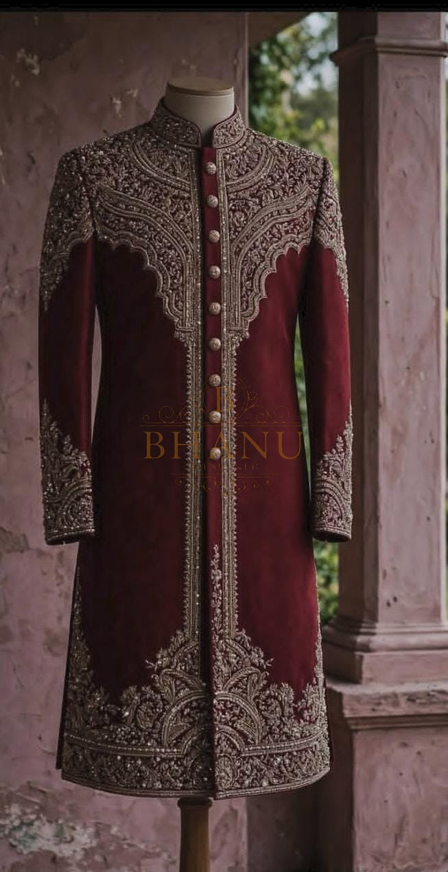 Maroon rajwadi sherwani with gold work across the yoke and front panels