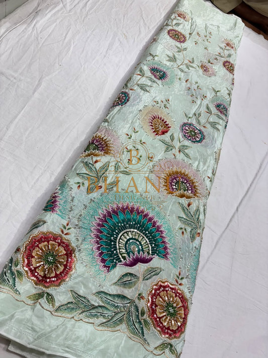 Natural crepe with a placed medallion print and scalloped border