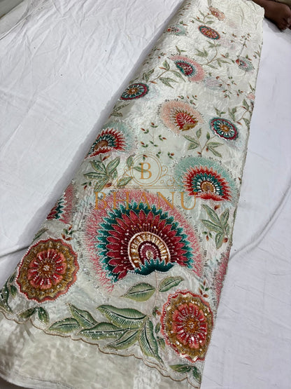 Natural crepe with a placed medallion print and scalloped border
