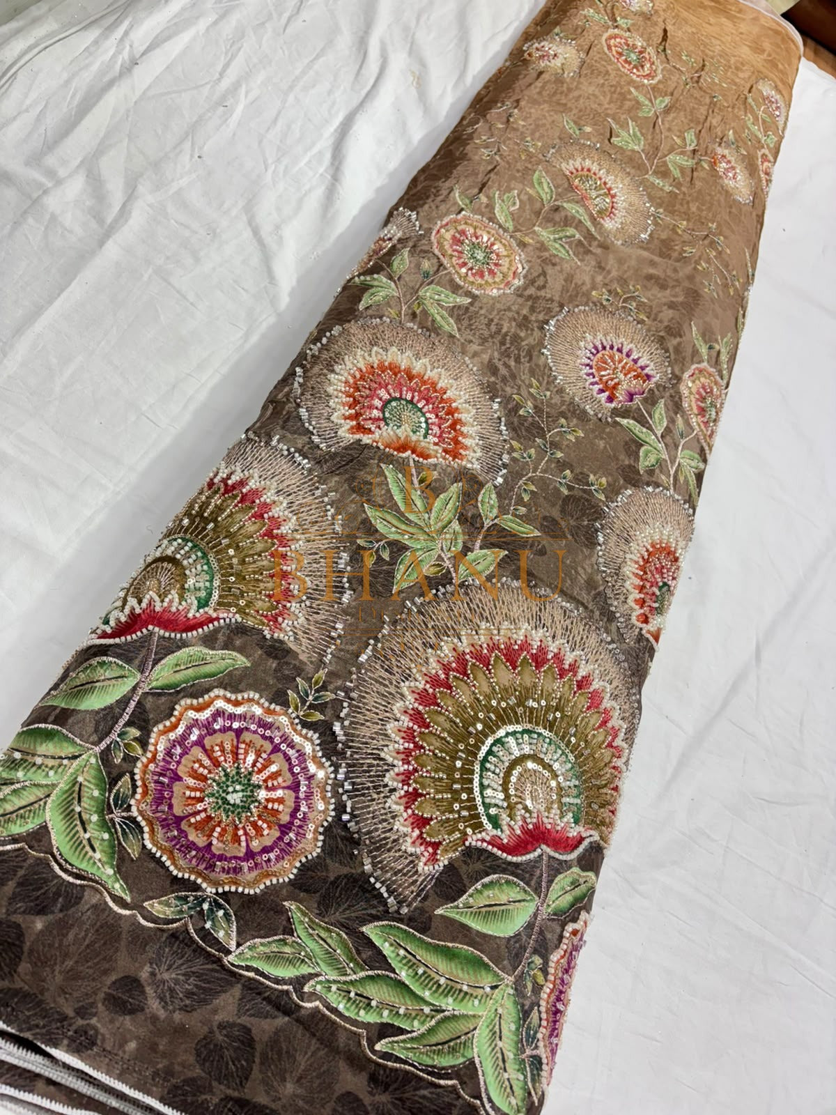 Natural crepe with a placed medallion print and scalloped border