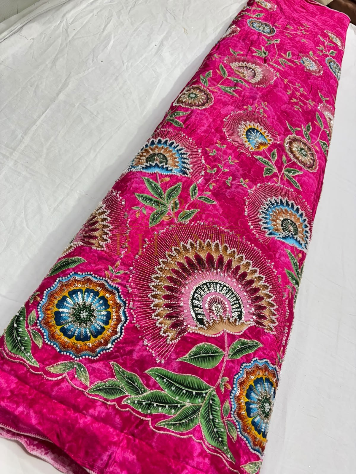 Natural crepe with a placed medallion print and scalloped border