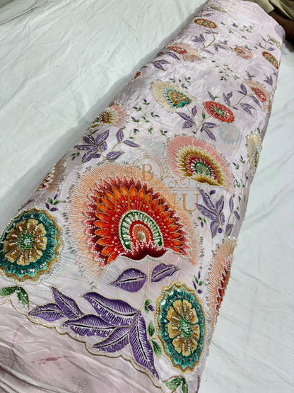 Natural crepe with a placed medallion print and scalloped border