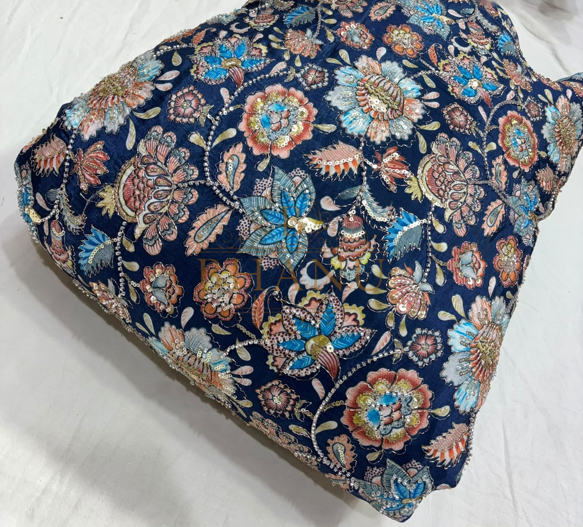Dense multicoloured floral and paisley work with beads and sequins
